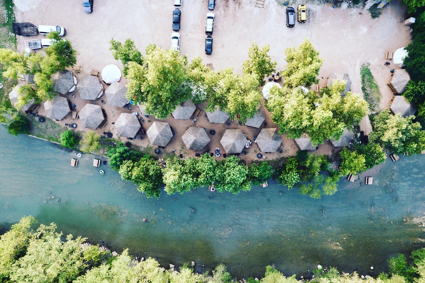 Aerial view of river and cabanas