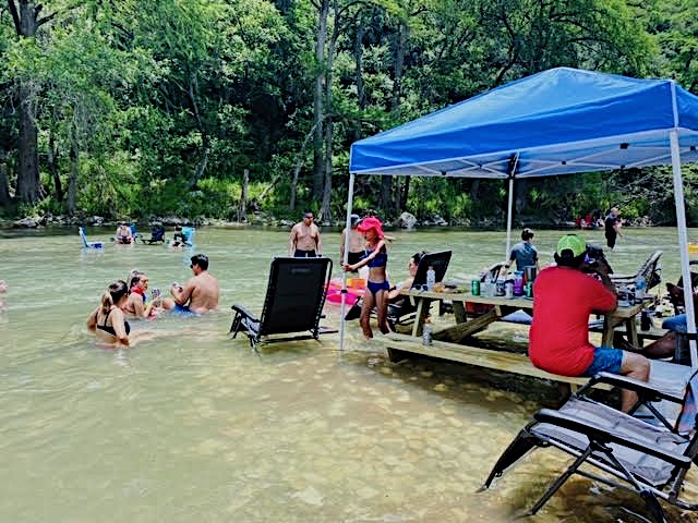 Family enjoying the river